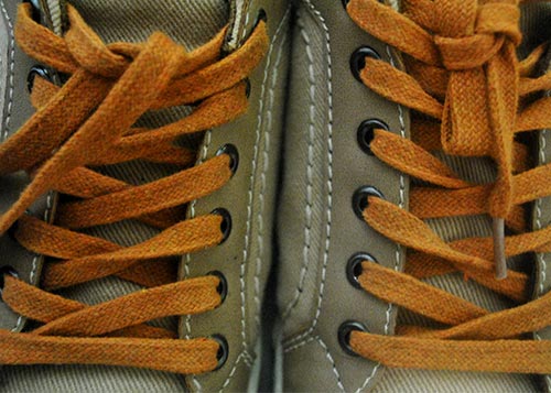 tan shoes with orange shoelaces